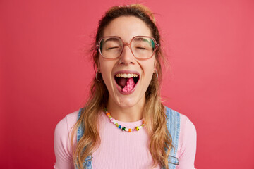 Teenage lady chewing bubble gum in studio