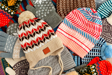 Bright hats, mittens and gloves for cold seasons. Hats, mittens, gloves are clothes for autumn and...