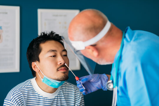 Doctor Taking Nasal Swab from Patient 