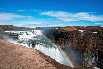 Fototapeta premium Scenic Cascades Of Gullfoss Waterfall In Golden Circle Against Blue Sky
