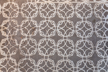 Texture background from a stucco wall covered with traditional patterns in Segovia, Spain