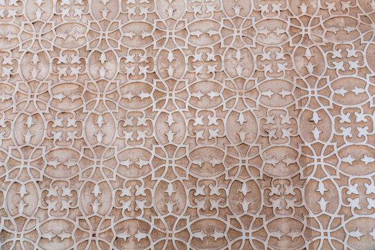 Texture background from a stucco wall covered with traditional patterns in Segovia, Spain