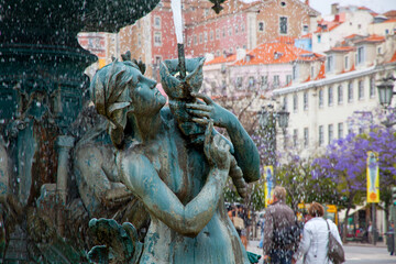 Close-up bronze fountain at Rossio square in Lisbon, Portugal