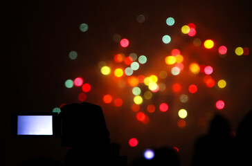 Unrecognizable people watch the New Year's Fireworks