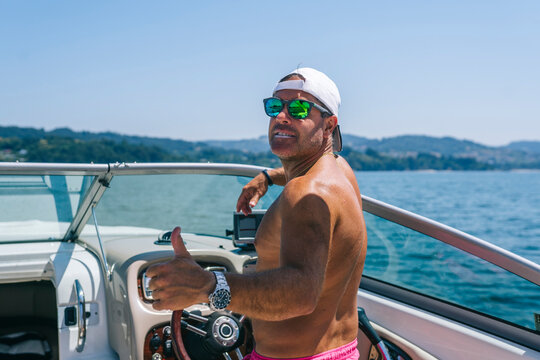 Man showing thumb up gesture on yacht