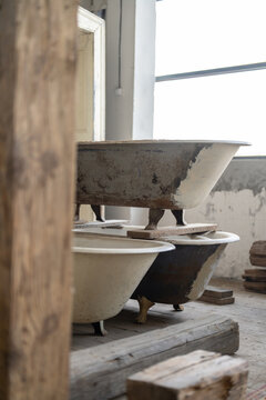 Vertical view of the old antique bath restoration in woodwork studio