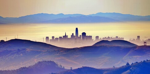 Scenic View Of Mountains And S. F.  Against Sky During Sunset - obrazy, fototapety, plakaty