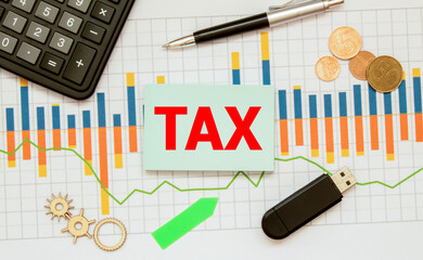 The word tax on a wooden block Business and tax ideas. Taxation. New year tax concept.