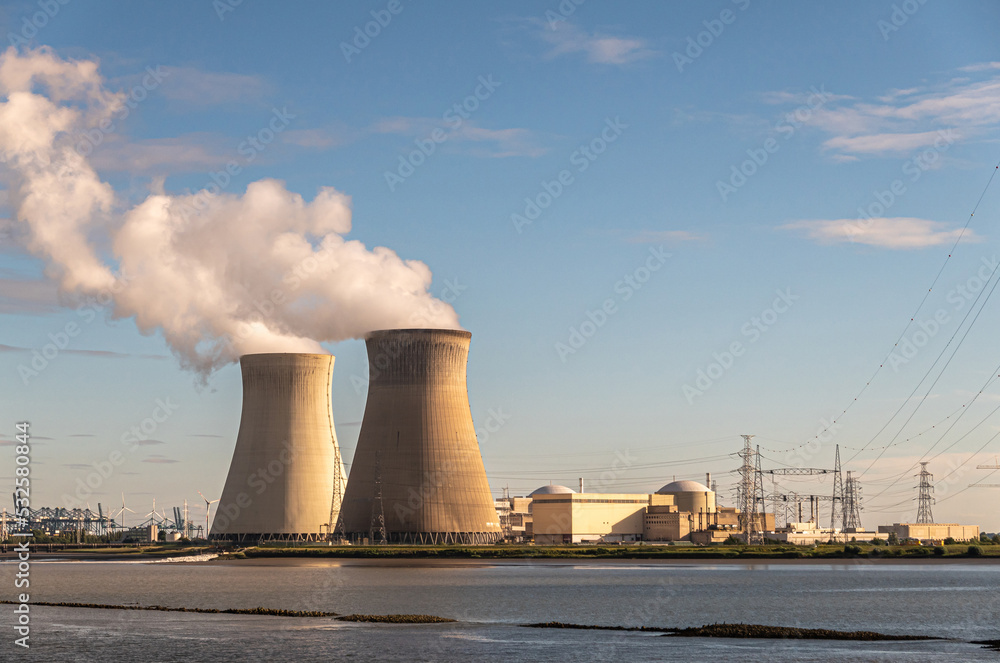 Wall mural antwerpen, flanders, belgium - july 10, 2022: sunset on cooling towers and doel nuclear power plant 