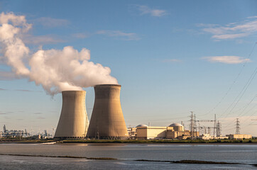 Antwerpen, Flanders, Belgium - July 10, 2022: Sunset on Cooling towers and Doel Nuclear Power plant...