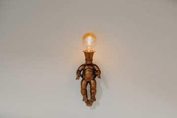 quirky bronze wall light bulb