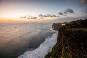 Uluwatu Cliff landscape at sunset time waves