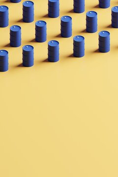 Group of blue oil drums isolated on yellow background