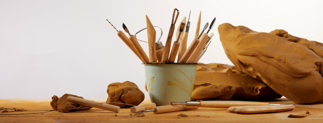 Clay with tools on table