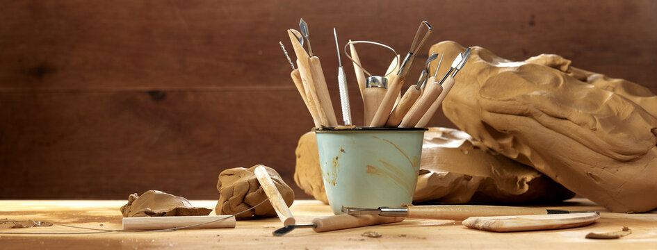 Assorted tools for pottery with clay