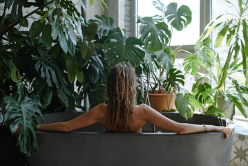 Woman relaxing in a bath