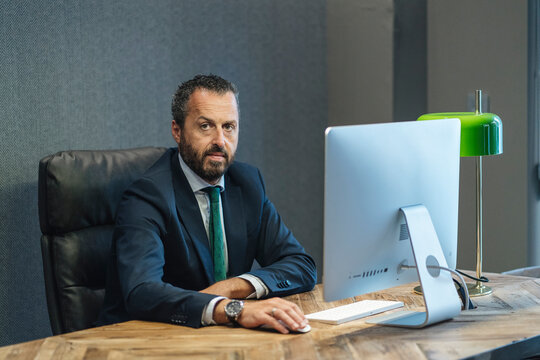Businessman looking at camera in office
