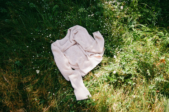 Jumper lies on the grass