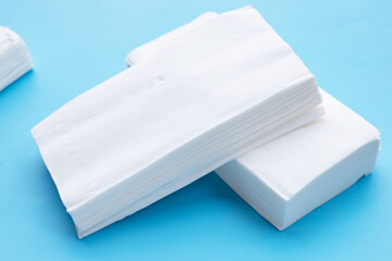Facial tissue on blue background.