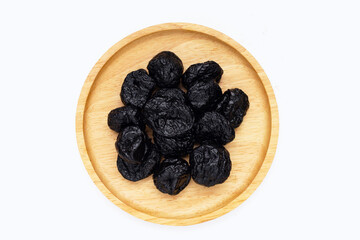 Dried prunes on white background