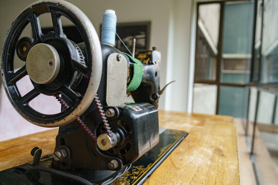 sewing machine with tread and needle in vintage mechanical steampunk machine