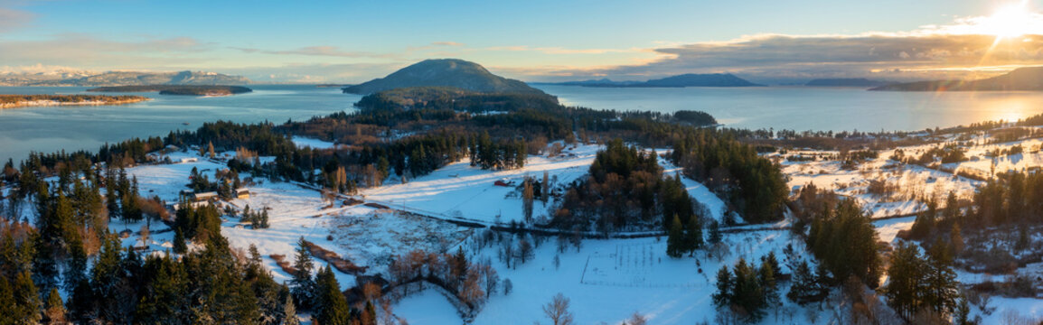 Sunset On A Snowy Island. Aerial View Of Lummi Island After A Fresh Dusting Of Snow.
