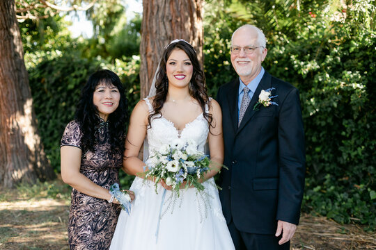Portrait of Bride with Her Parents on Her Wedding Day