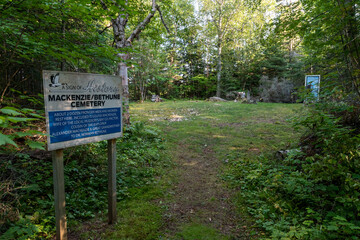 A sign marks the entrance to the Bethune pioneer cemetery nestled in the woods in the small Ontario town of Wawa.