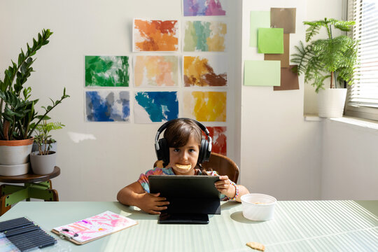 little girl using tablet