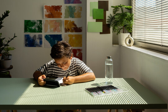 Boy Drawing Holding Smartphone Indoor