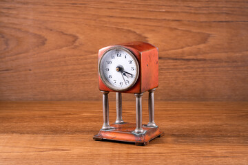 Vintage small metal decorative copper colored alarm clock with faux stand