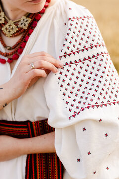 Woman considering embroidery on apparel 