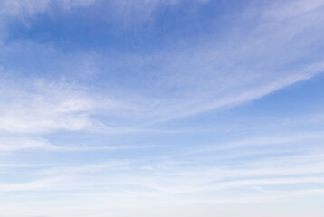 The vast sky and the white clouds float in the sky. The natural blue background has a breeze on a bright day in the summer.The sky and clouds are not the same shape as the weather.