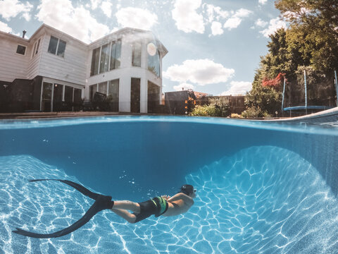 boy diving in pool