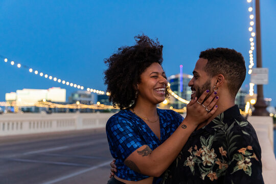 Young Black couple in love and hugging and preparing to kiss 
