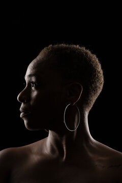 Portrait of an afro woman on black background