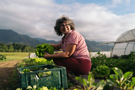 Smiling female farmer working