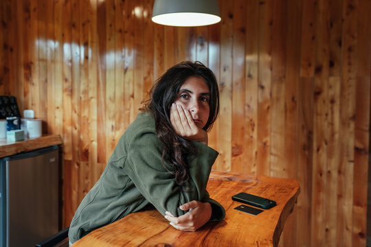 sleepy woman looking at camera