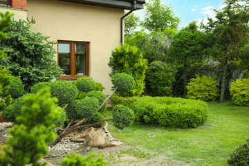 Picturesque view of beautiful house and garden on sunny day