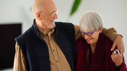 Laughing elderly couple together.