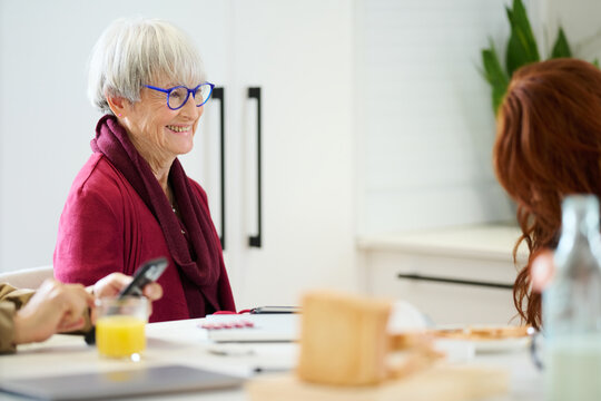 Smiling grandmother in kitchen.