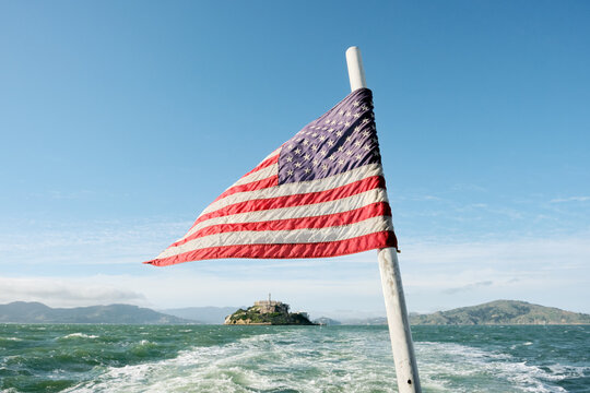 American flag on a boat in the bay