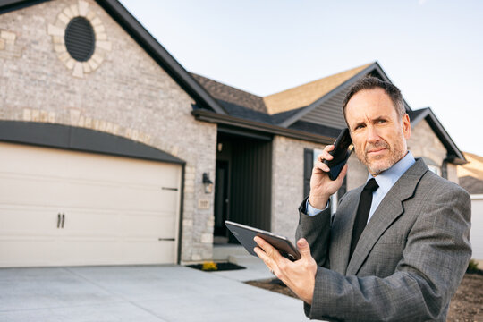 Real Estate Agent In Phone Discussion