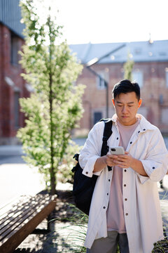 Guy using GPS in cellphone 