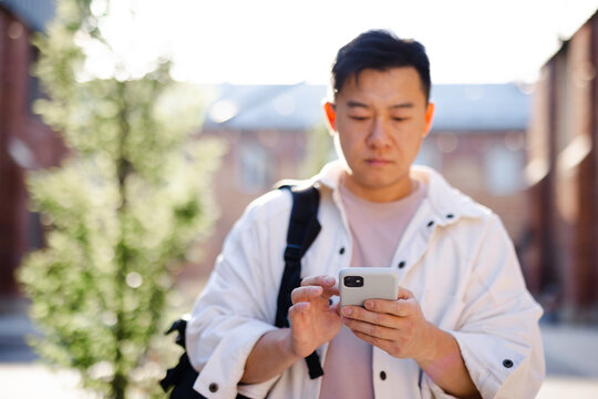 Guy surfing net in phone 