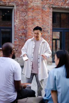 Man attracting attention of his acquaintances 