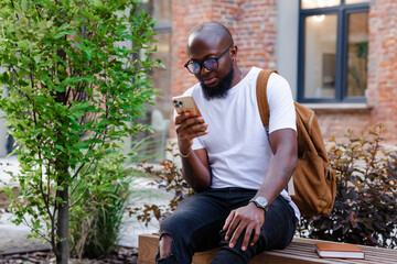Man using smartphone in free time 