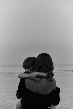 mother with her child near the sea