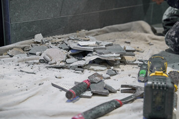 Broken tiles being replaced