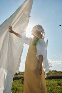 Checking Bedsheet On Clothesline
